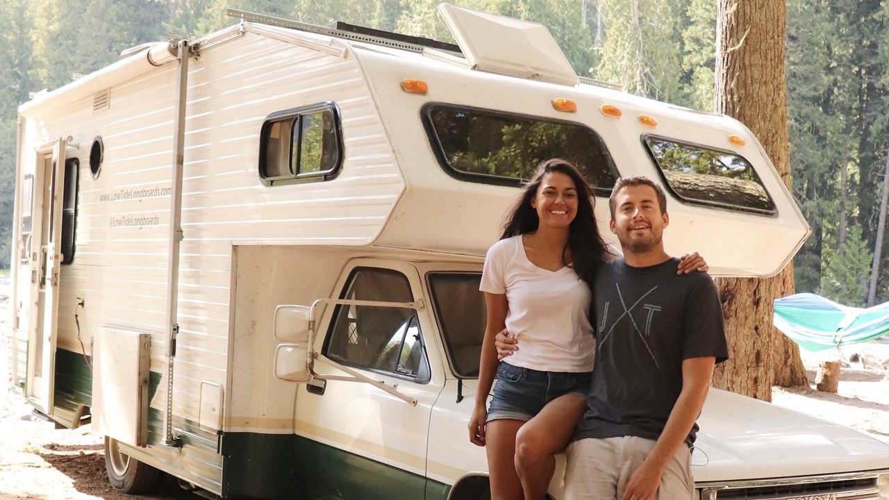 Man and woman outside a Class C Motorhome