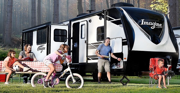 Grand design camper withi family outside