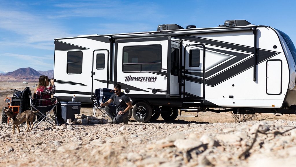 momentum rv with couple camping outside