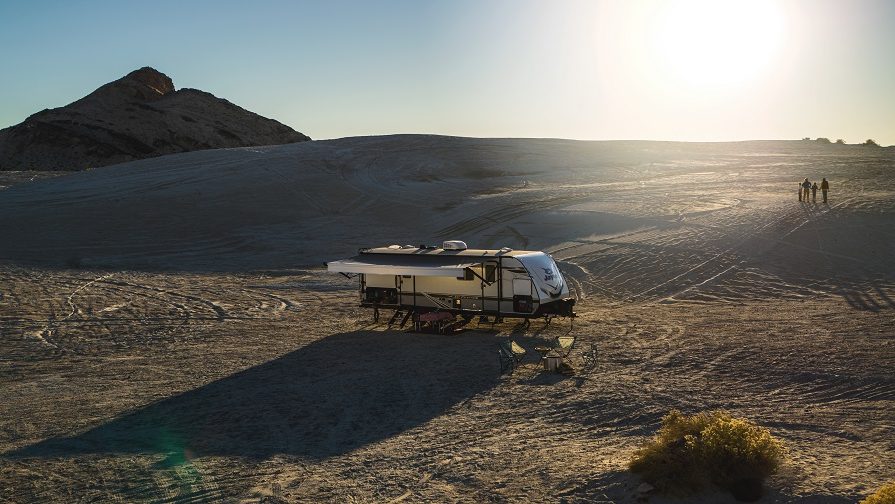 family walking in scenic location with their jayco jay feather rv