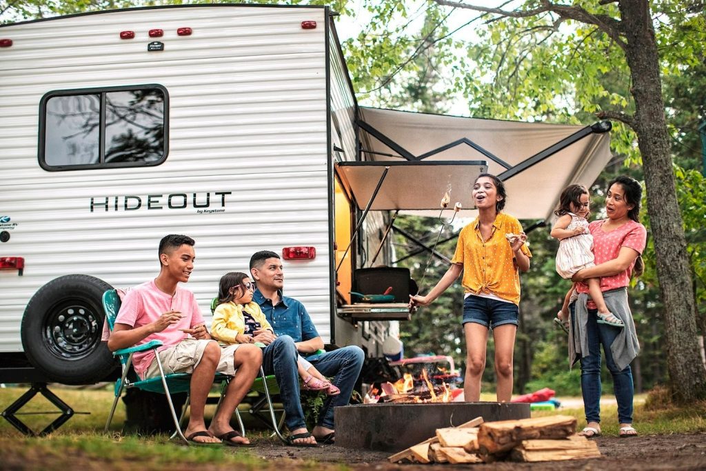 Family Camping with a Keystone Hideout RV roasting marshmallows