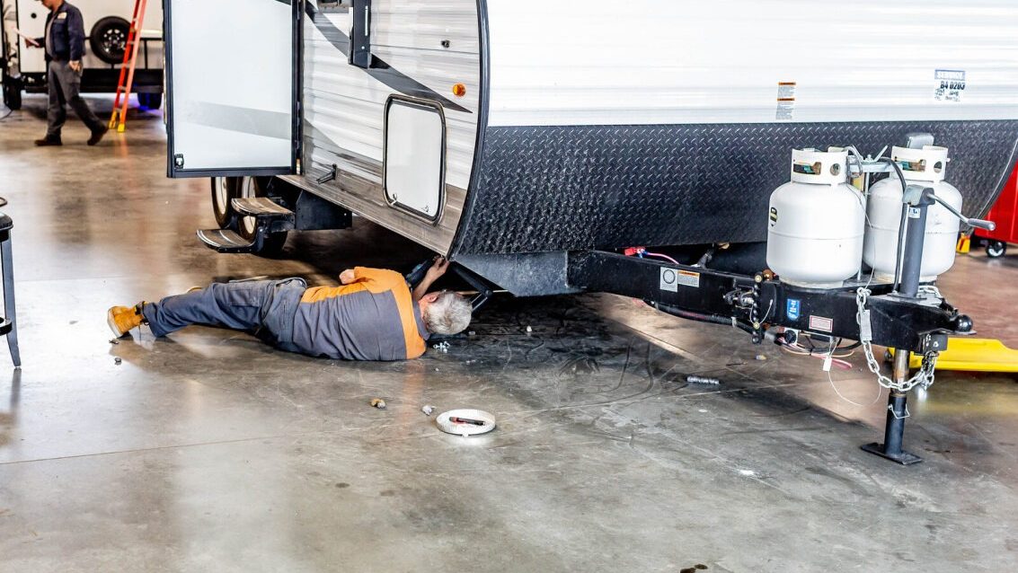 RV technician repairing an RV