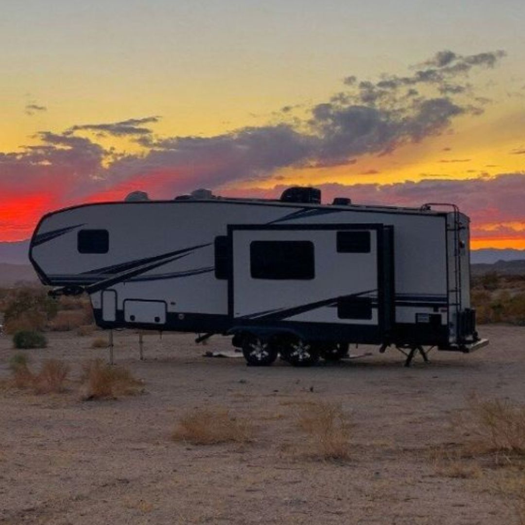 Fifth Wheel in the desert with a setting sun