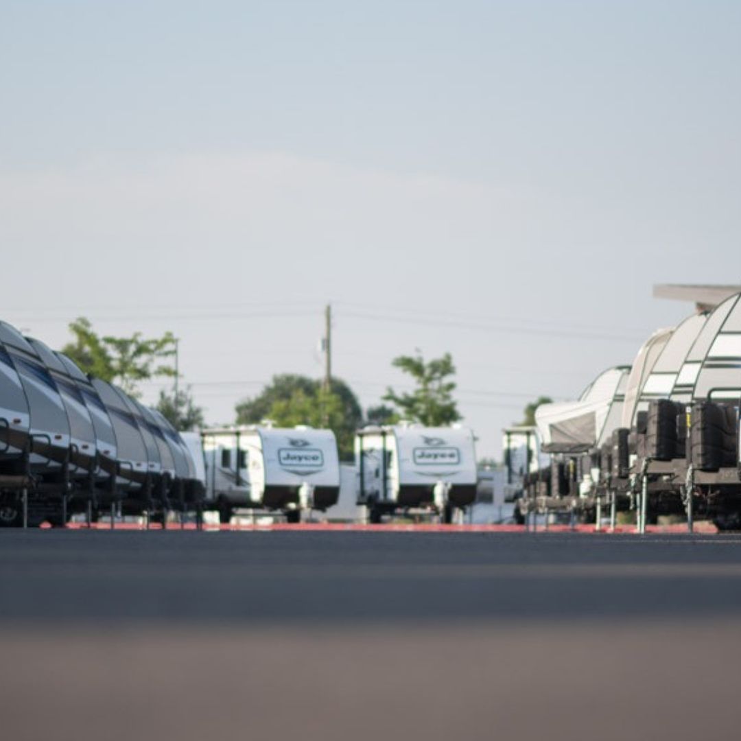 RVs in a row on a dealer lot