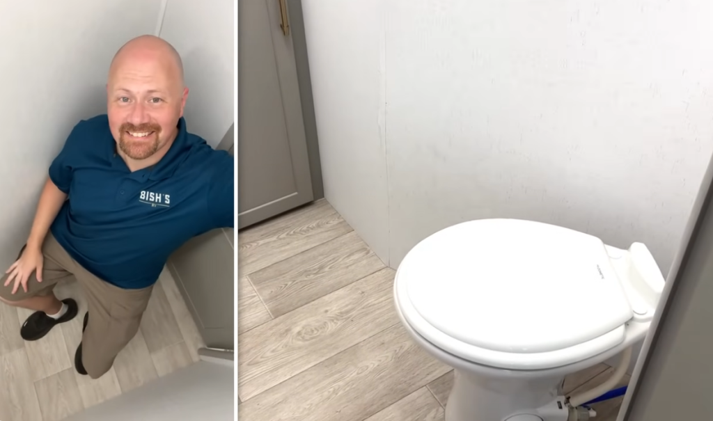 Bathroom in the 2026 Axiom Imperium I3800 fifth wheel featuring a spacious layout with residential-style toilet, light wood flooring, and ample legroom for added comfort and usability.