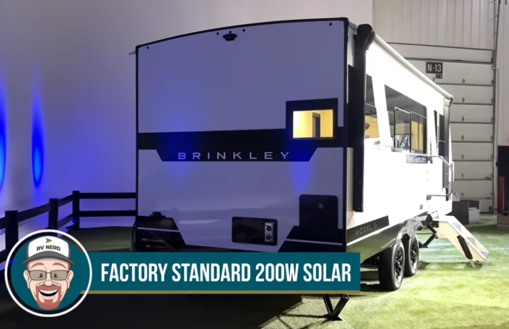 Rear exterior of Brinkley Model Ix 20X travel trailer with factory standard 200W solar panel system, LED lighting, and modern painted aluminum body design.