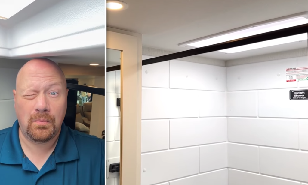 2026 Winnebago Thrive 22MLS shower with skylight for added headroom, featuring bright white tile-style walls and a spacious design suitable for taller RV users.