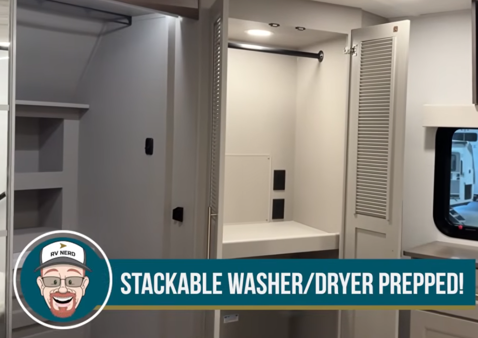 Alliance Paradigm bedroom closet prepped for stackable washer and dryer installation, featuring built-in shelves, hanging rods, and vented cabinet doors.