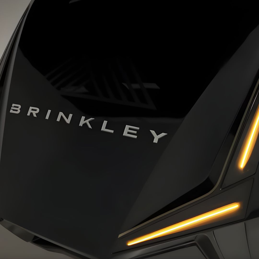 Close-up of Brinkley RV front cap with sleek black finish and illuminated amber LED accent lights, showcasing the brand’s modern luxury design and premium craftsmanship.