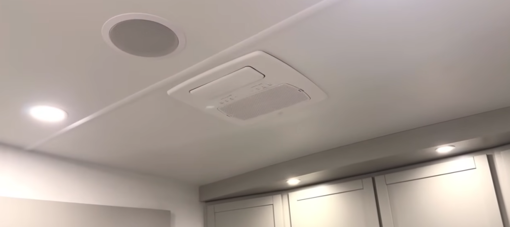 Ceiling of the Brinkley Model Z 3600 showing quiet-cool air conditioning vent, recessed LED lighting, and built-in speaker for a clean residential finish.