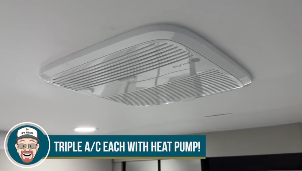 Ceiling-mounted RV air conditioning vent showing one of the triple A/C units with integrated heat pump in a modern Brinkley fifth wheel.
