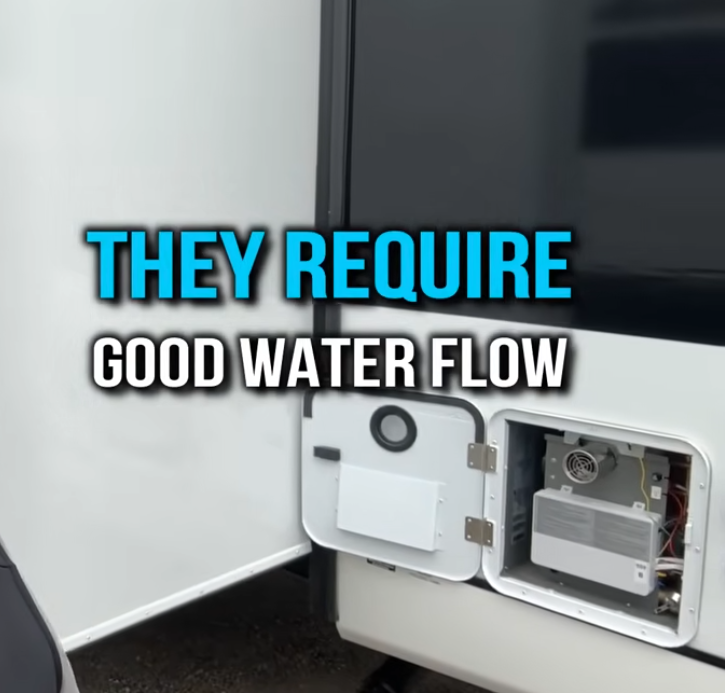 RV tankless water heater access panel with text overlay reading ‘They require good water flow,’ highlighting RV water heater operation and plumbing requirements
