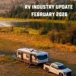 Travel trailer and pickup truck camping beside river in scenic landscape for RV industry update article