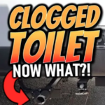 Bold graphic reading “Clogged Toilet – Now What?!” in large orange and white text with a red arrow pointing toward an RV sewer outlet connection, illustrating RV black tank or toilet clog troubleshooting.