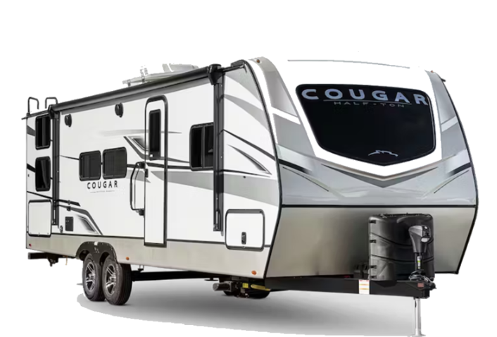 Keystone Cougar Half-Ton travel trailer with gray and white exterior, dual axles, and front hitch setup displayed on a white background.