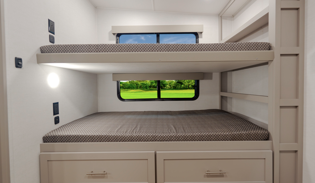 Travel trailer bunk room with double-over-double bunk beds, built-in ladder, storage drawers below, and a window between the bunks