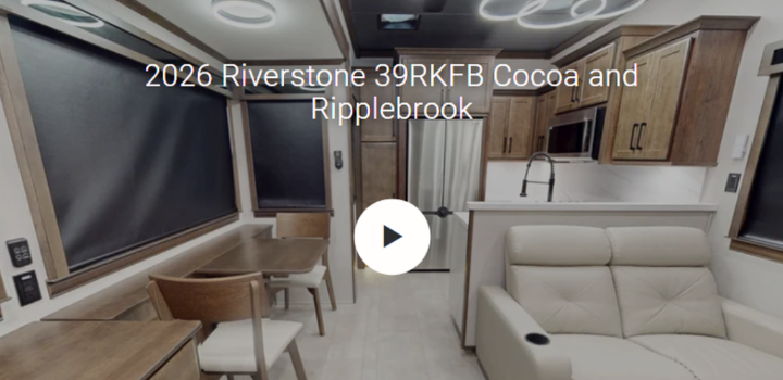 Interior of the 2026 Forest River RiverStone 39RKFB luxury fifth wheel featuring a spacious rear kitchen, residential dining area, theater seating, solid-surface countertops, stainless steel appliances, and premium wood cabinetry in the Cocoa and Ripplebrook décor. Designed for full-time RV living, this upscale floorplan offers residential comfort, luxury finishes, and an open-concept living space ideal for extended travel and camping