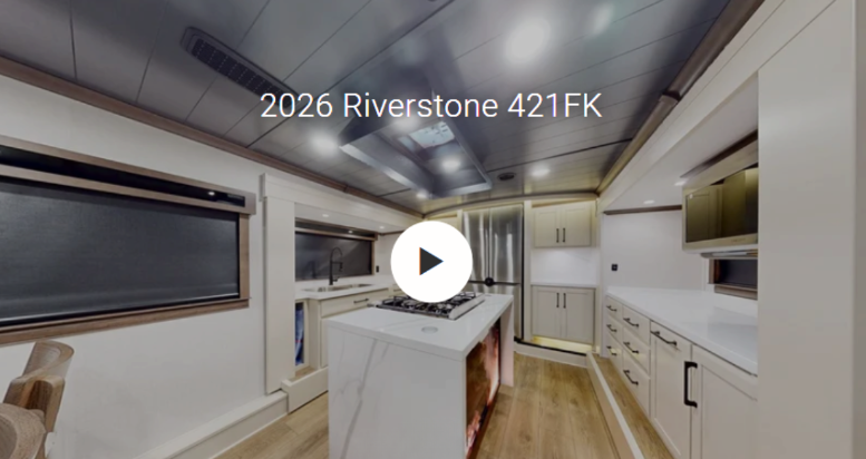 Interior of the 2026 Forest River RiverStone 421FK luxury fifth wheel featuring a spacious front kitchen with a large center island, solid-surface countertops, residential appliances, abundant cabinetry, and premium finishes. Designed for full-time RV living, the 421FK offers an open-concept layout that combines residential luxury, generous storage, and upscale craftsmanship for extended travel and comfortable camping.